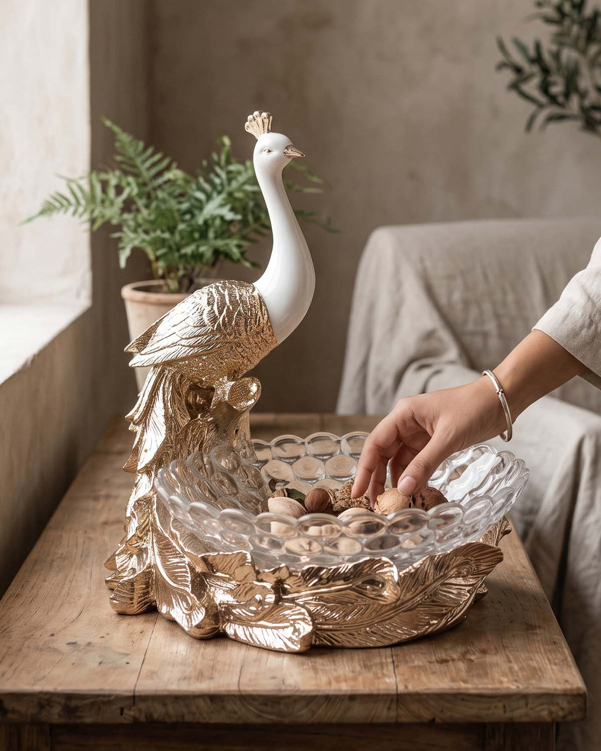 Royal Peacock Fruit Basket featuring an elegant gold feather design