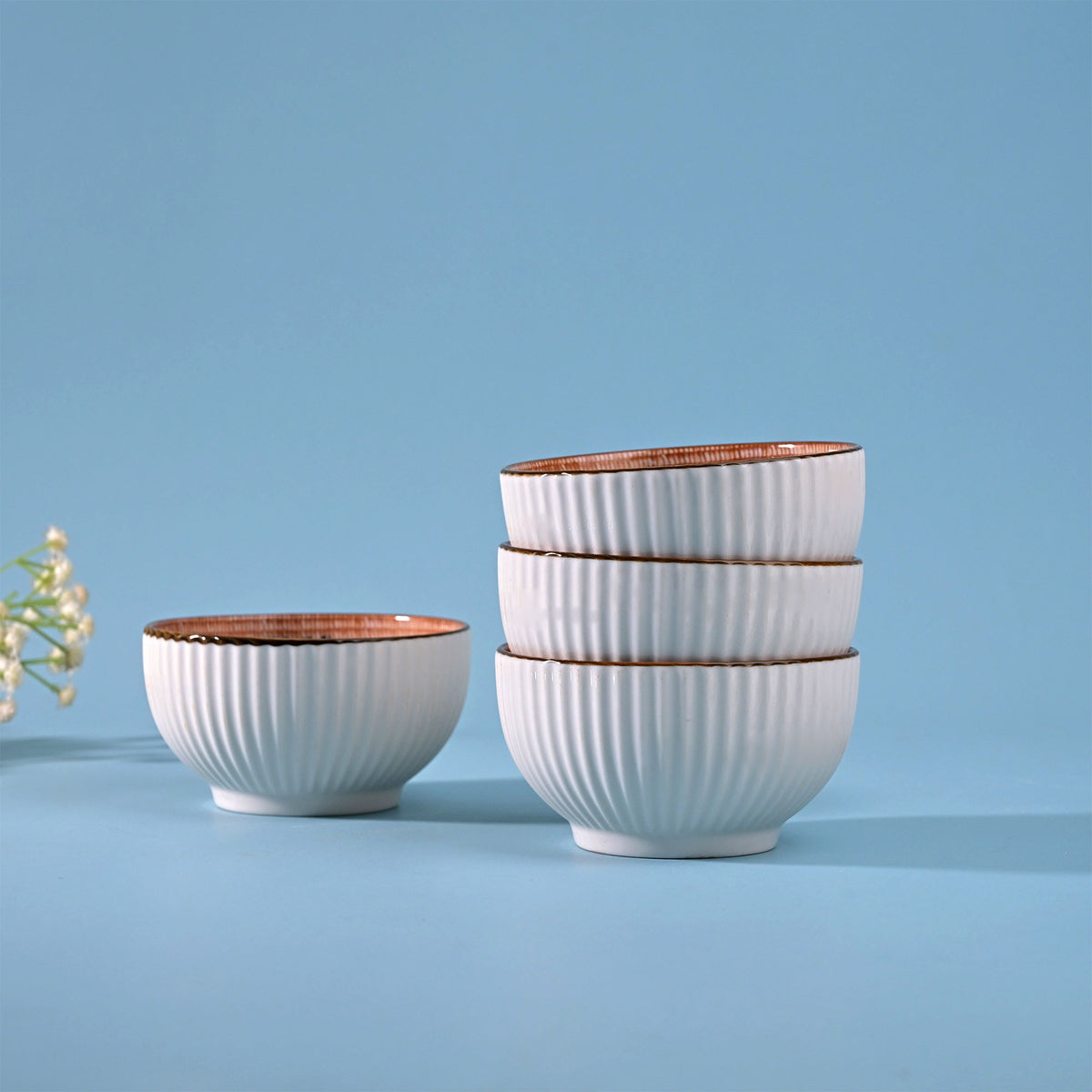 Stylish set of four ribbed porcelain bowls