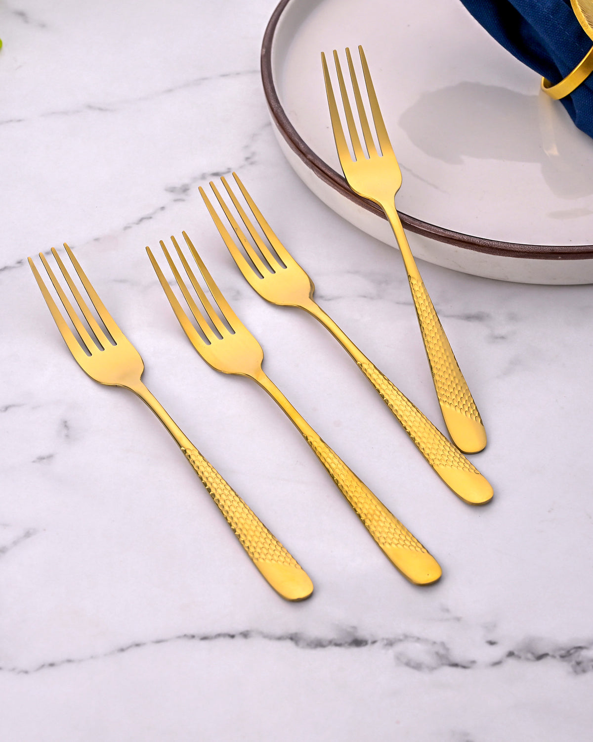 Close-Up View of Luxe Golden Dessert Forks with Shiny Details