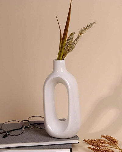 Minimalist white hollow vase with modern sculptural design