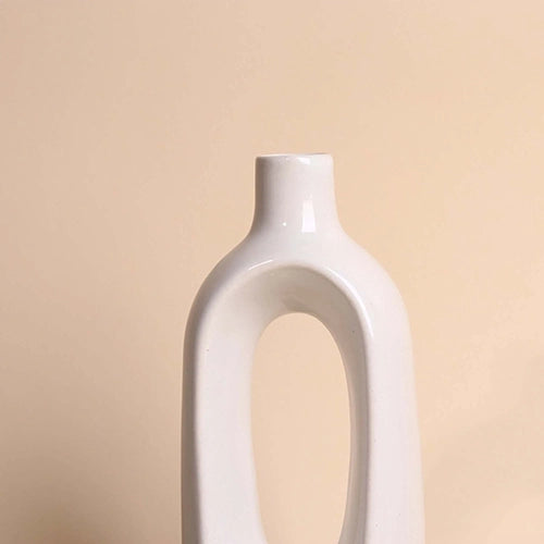 Sculptural white vase with a unique hollow design