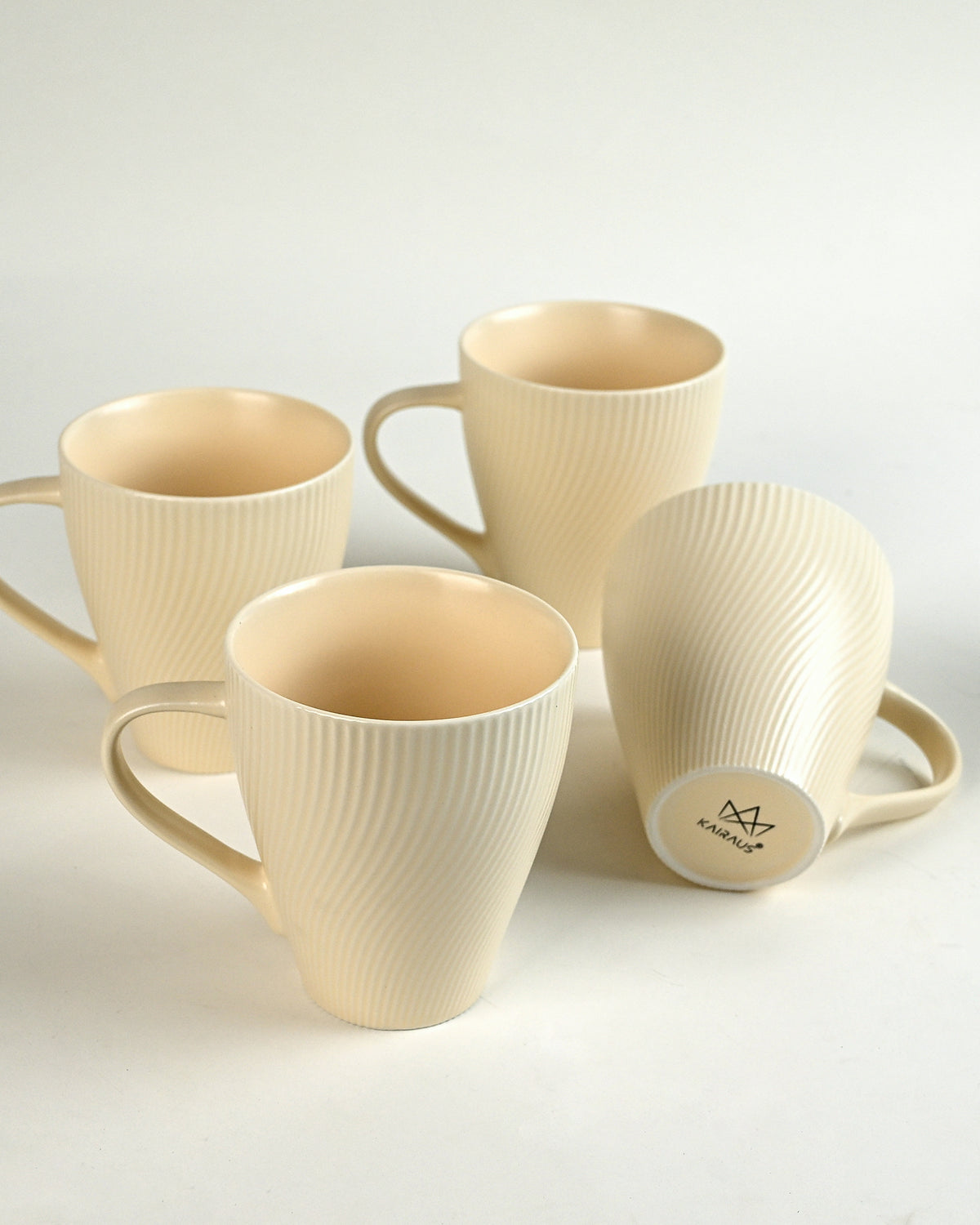 Set of 4 pale peach coffee mugs