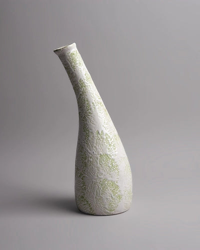 Decorative pastel green vase featuring a textured finish