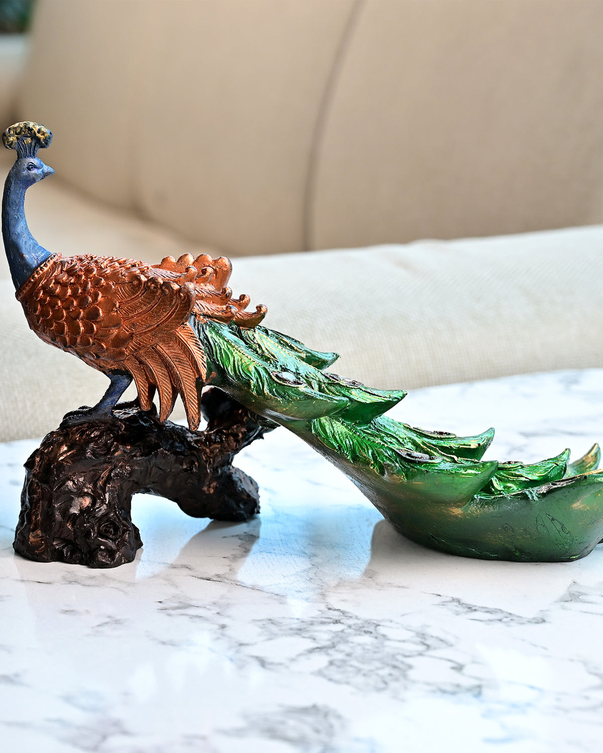 Wooden tree trunk statue featuring a colorful peacock