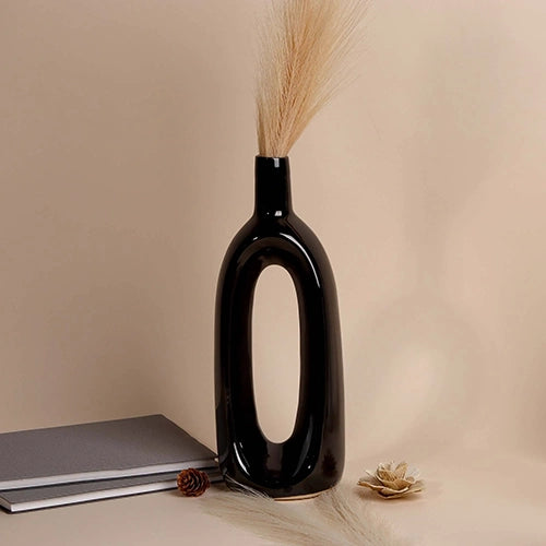 Pitch black hollow vase with minimalist sculptural design