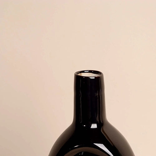 Modern black hollow vase with a sleek contemporary finish