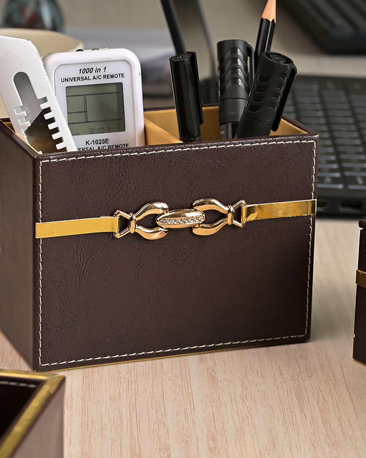 Decorative maroon leather desk accessory organiser