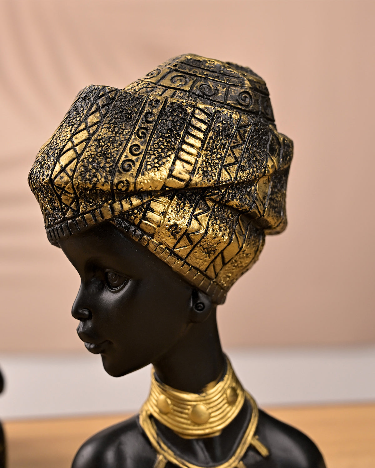 African queen figurines in regal poses for interior decoration