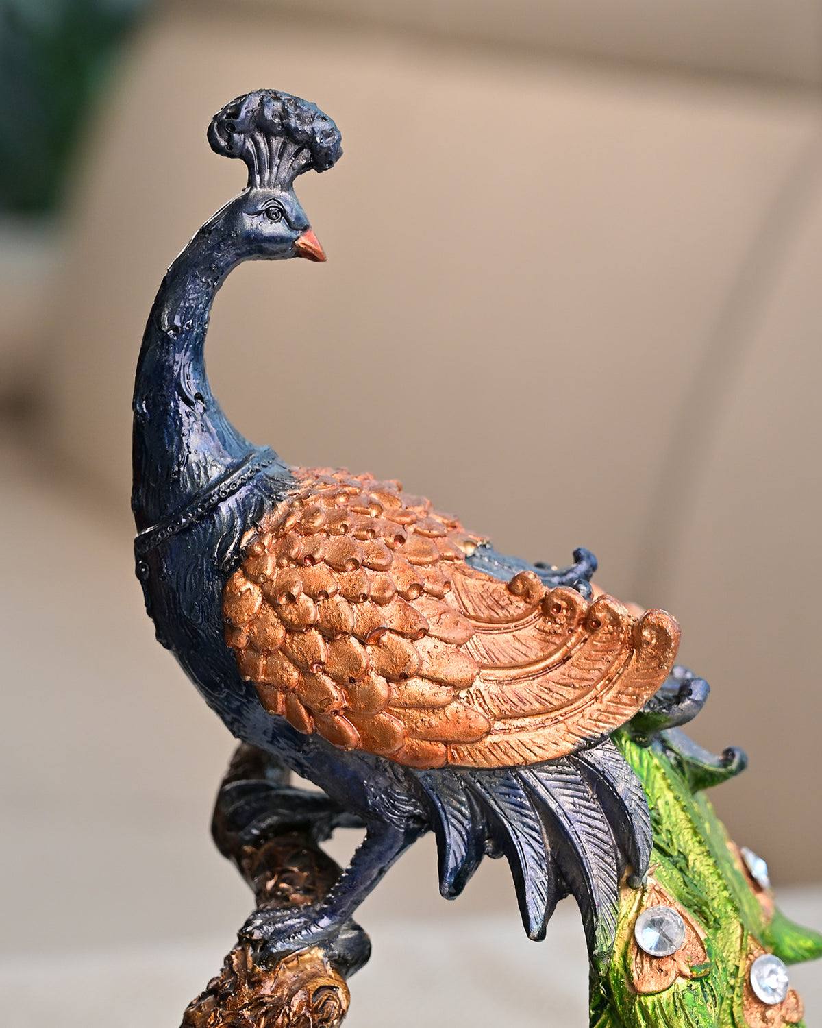 Elegant peacock statue with detailed feathers for home decoration
