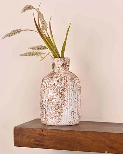Handmade-style white ceramic vase with a natural finish