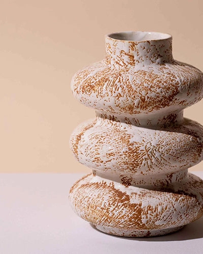 Sculptural ceramic vase with three interconnected rings