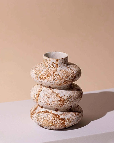 Artistic ceramic vase with a distinctive three-ring design