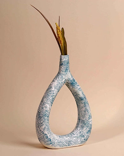 Teal textured triangle vase with modern sculptural design