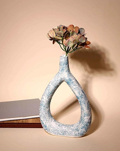 Artistic triangular vase with intricate surface texture