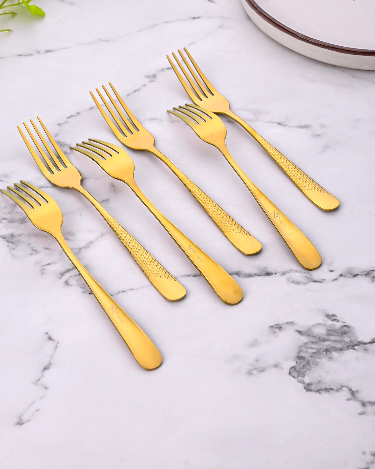 Close-Up View of Timeless Golden Forks with a Shiny Finish