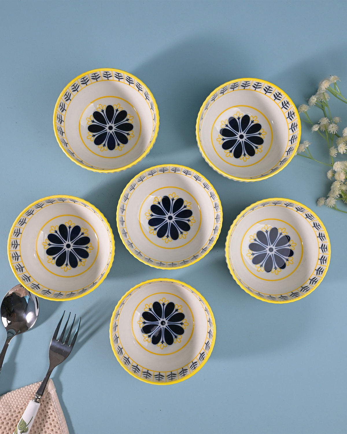 Set of six white porcelain bowls with floral designs