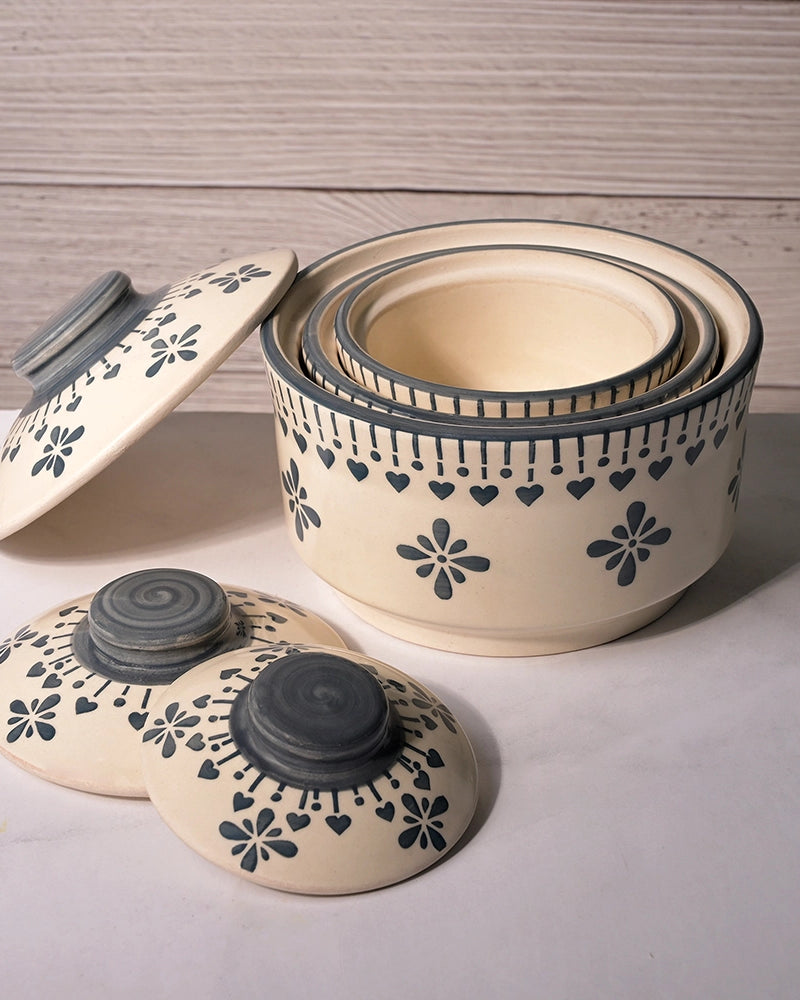 Grey and white ceramic serving bowls with lids