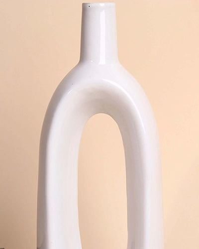 Modern hollow vase in a sleek white glossy finish