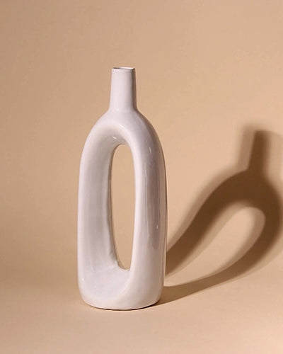 Sculptural white glossy vase for contemporary interiors