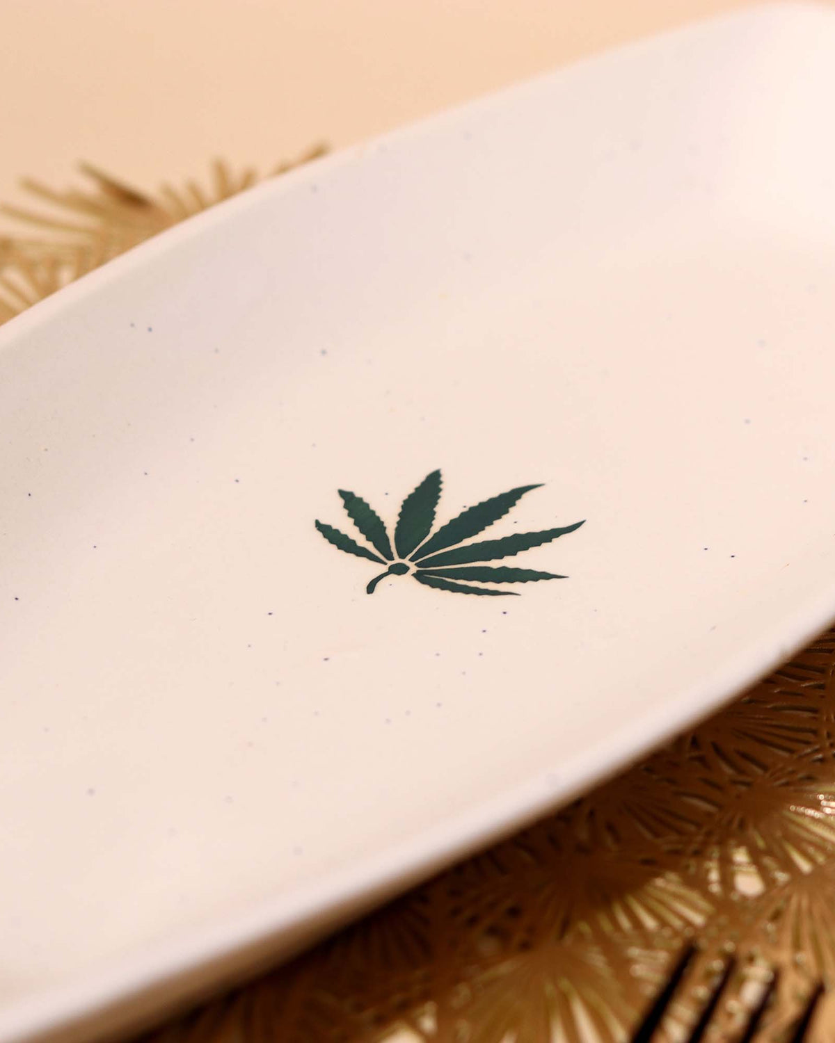 Decorative white ceramic platter with leaf design
