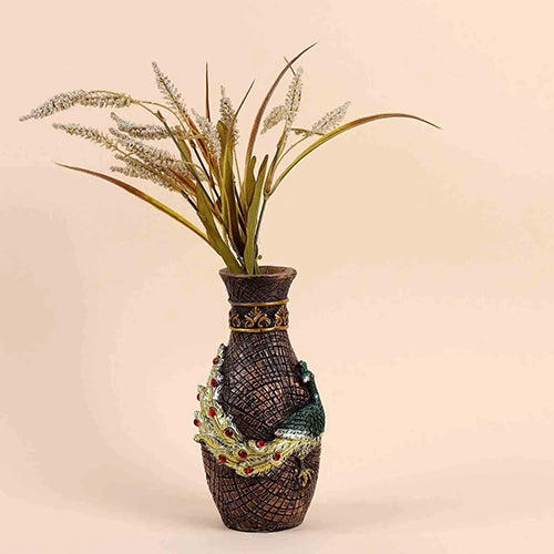 Antique vase decorated with intricate peacock design

