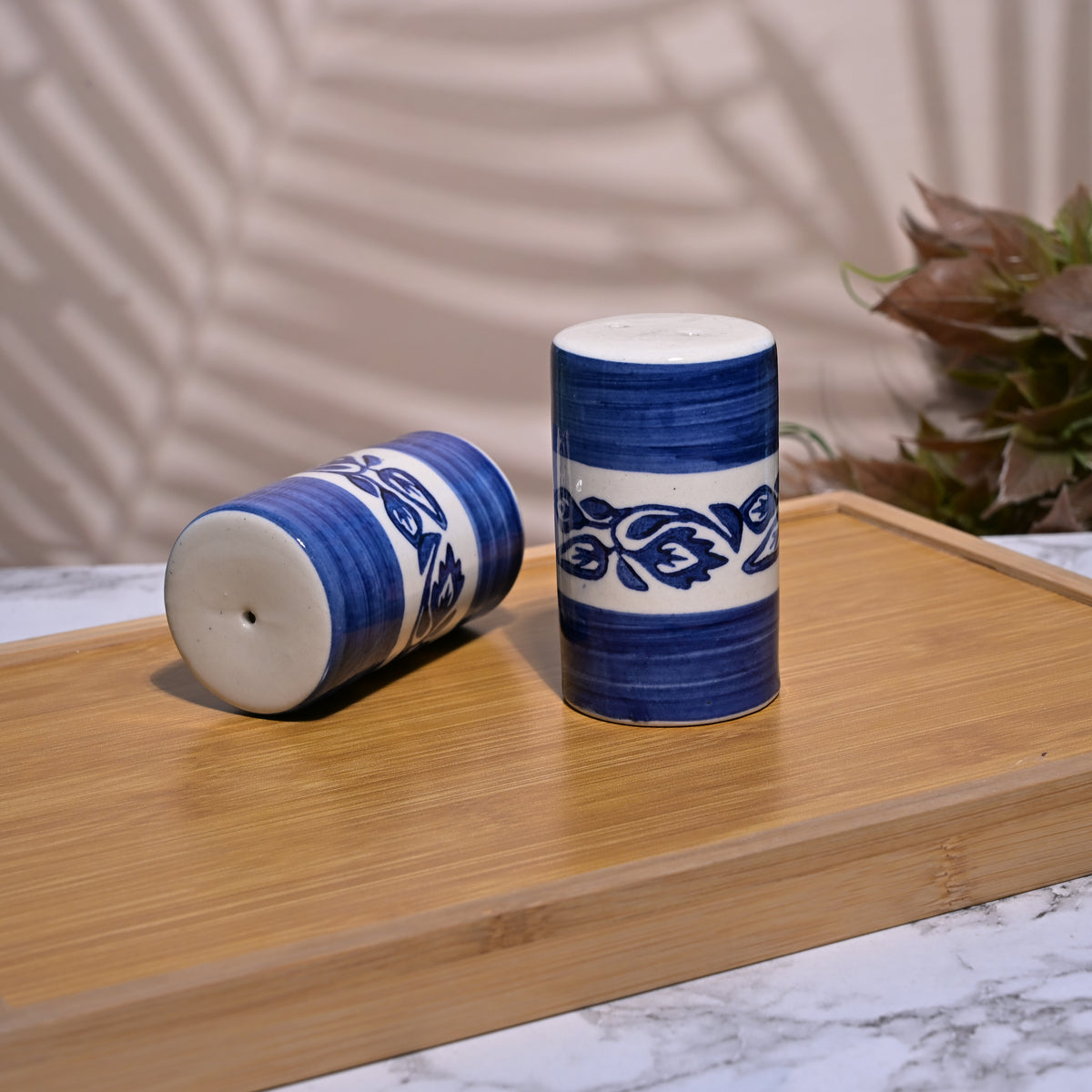 Elegant blue ceramic salt and pepper set for dining table
