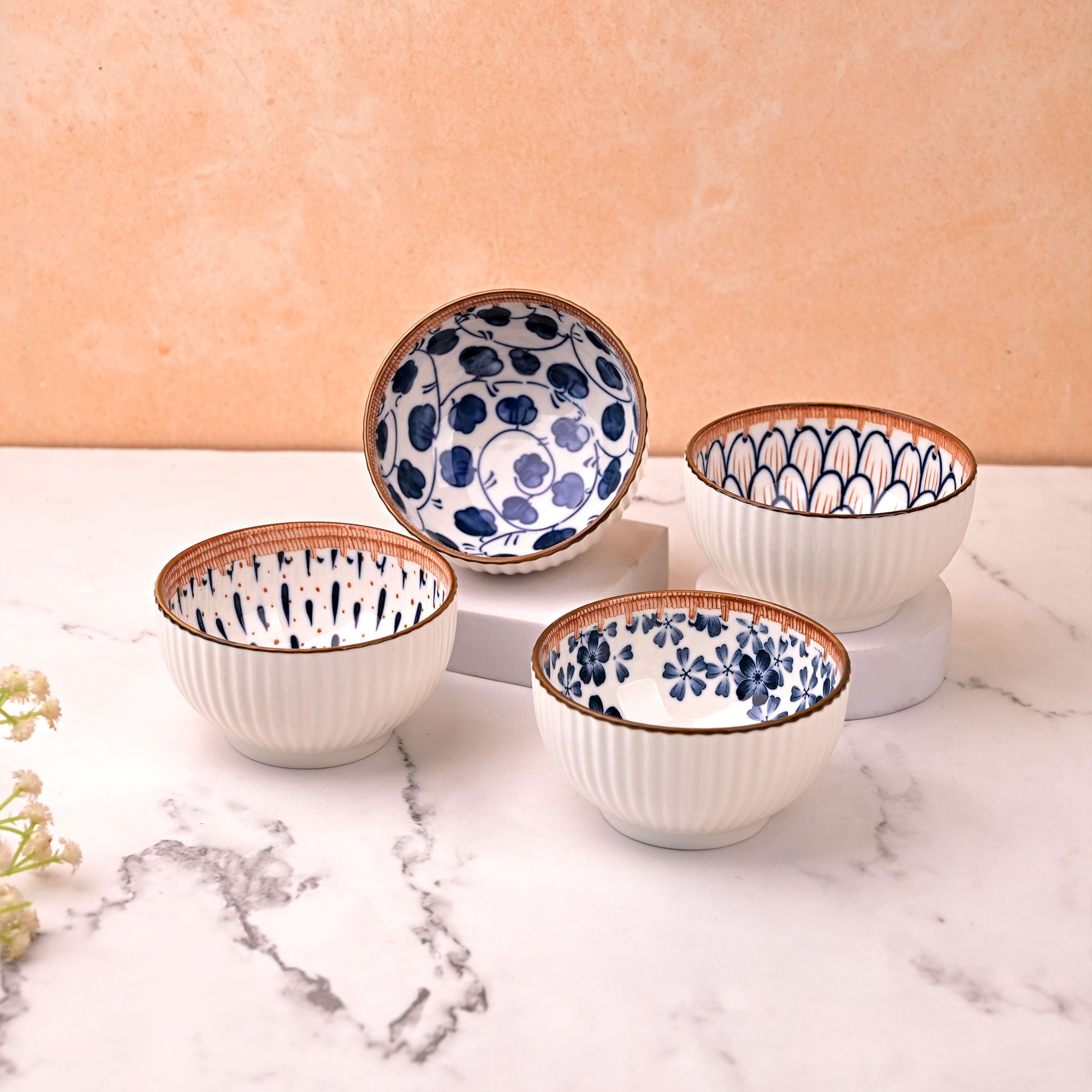 Set of four autumn-inspired porcelain serving bowls

