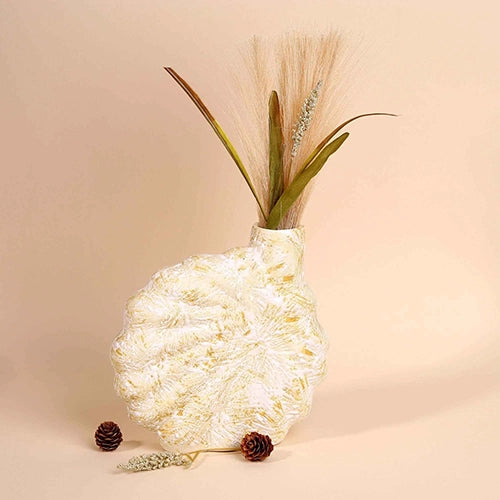 Beige shell flower vase with elegant decorative design


