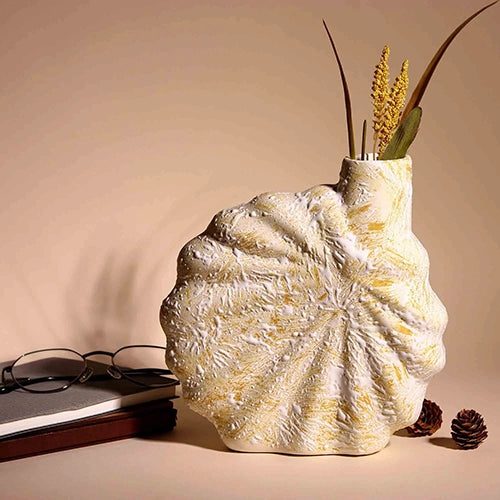 Modern beige flower vase with textured shell design

