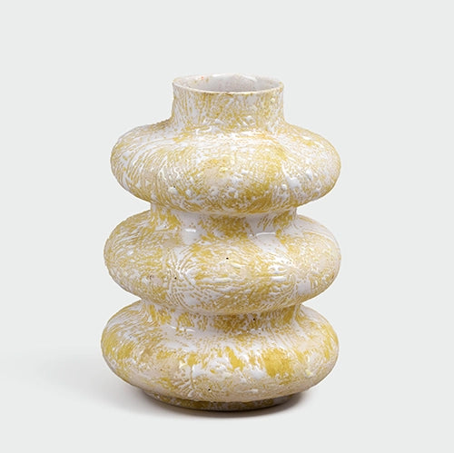 Elegant beige ceramic vase featuring a unique tri-ring shape

