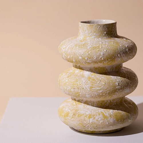 Beige tri-ring flower vase for stylish interiors

