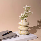 Artistic ceramic vase with a distinctive three-ring design

