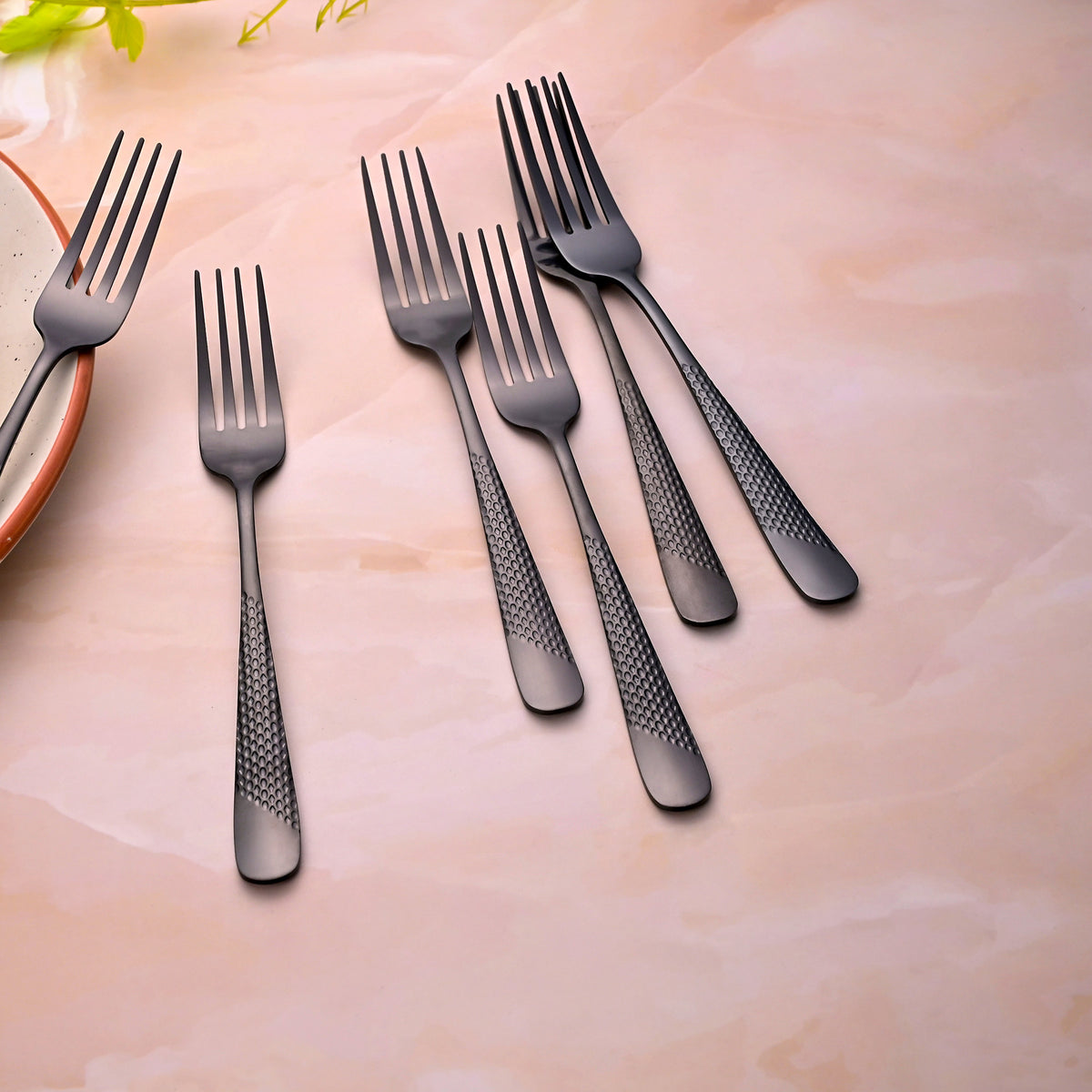 Close-Up View of Black Flame Stainless Steel Forks with a Refined Finish

