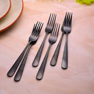 Black Flame Forks Set of 6 Displayed with Modern Tableware

