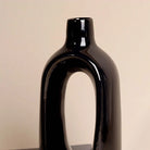 Sleek sculptural black vase for stylish home decoration

