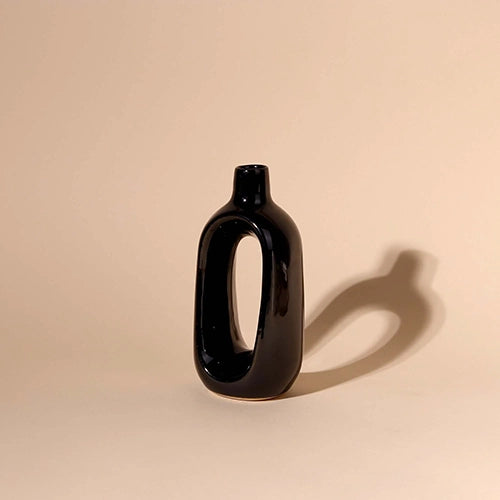 Modern black hollow vase for living room decor

