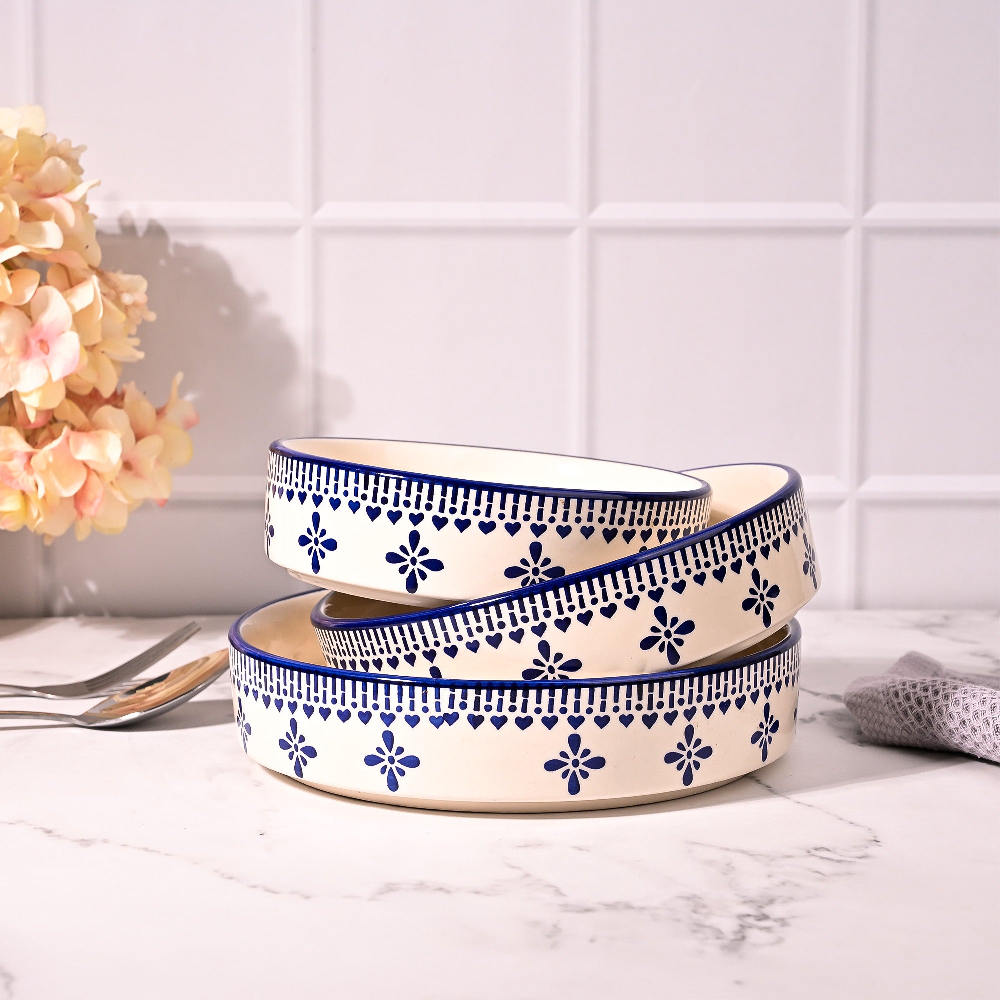 Blue and white serving bowls arranged together

