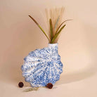 Blue shell flower vase with elegant decorative design

