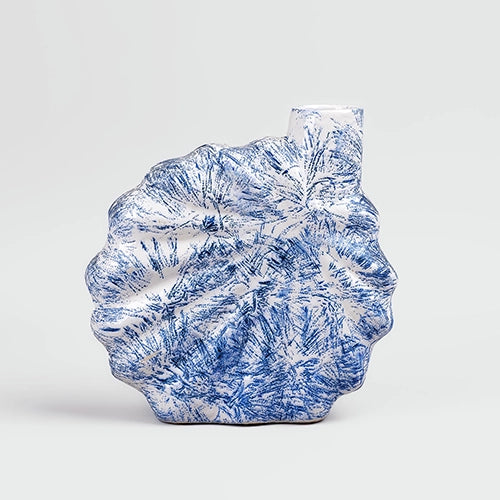 Decorative blue vase featuring a beautiful shell-inspired pattern

