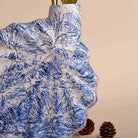 Stylish shell-inspired vase in a rich blue finish

