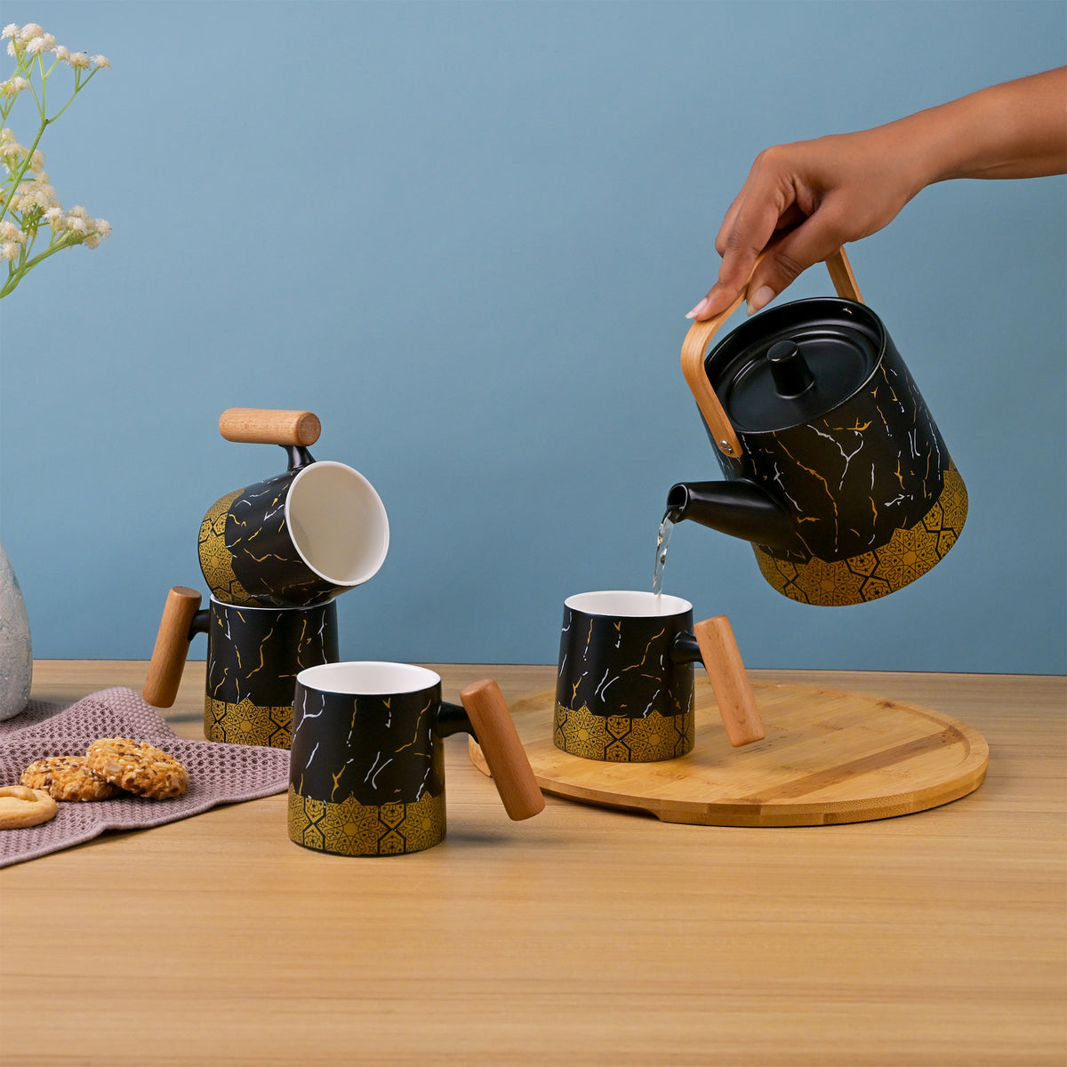Bronze Decor Black Tea Set Displayed on a Dining Table