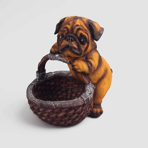 Adorable brown dog figurine sitting in a basket


