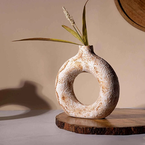 Brown donut ring vase with modern sculptural design


