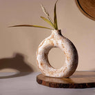 Brown donut ring vase with modern sculptural design

