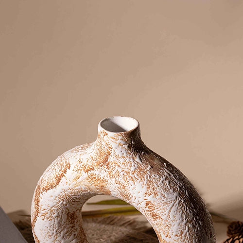 Decorative brown donut vase for stylish interiors

