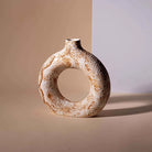 Contemporary donut ring vase in a warm brown finish

