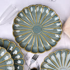 Set of 4 brown flower shaped ceramic plates

