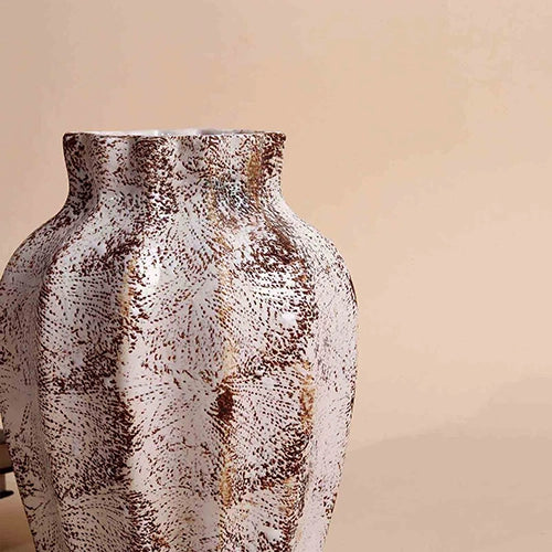 Rustic brownish vase with intricate scalloped texture

