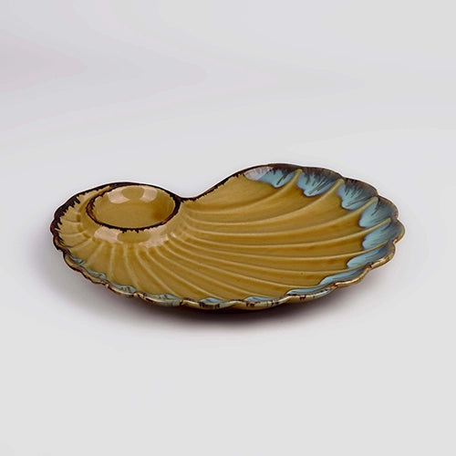 Handmade shell serving platter in brownish yellow

