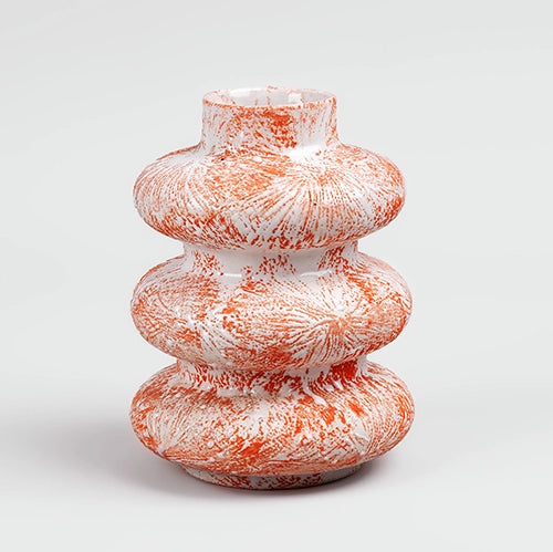 Elegant burnt orange ceramic vase featuring a unique tri-ring shape

